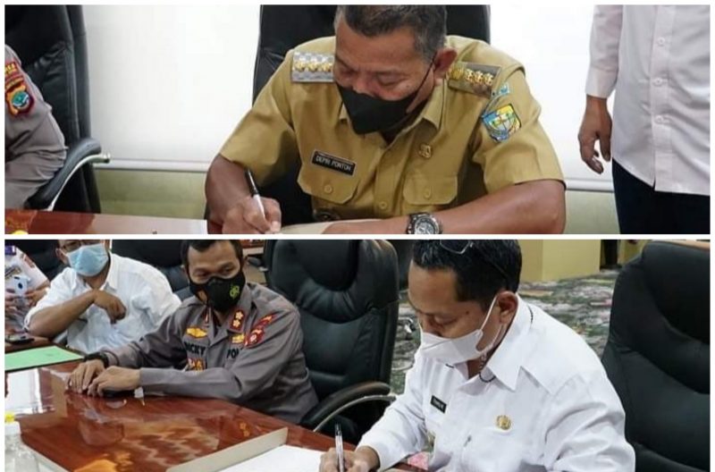 Potret penandatanganan nota kesepatakan antara Pemda Bolmut dan Gorut